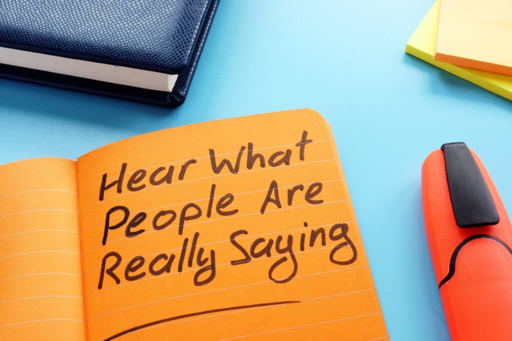 Hear what people are really saying sign. Active listening technique concept.