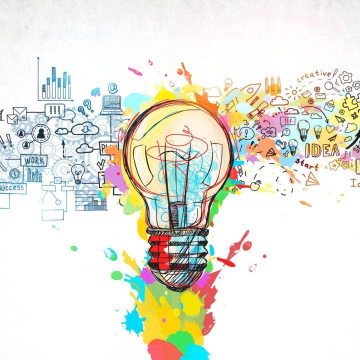 Creative and colorful light bulb sketch and business plan icons drawn on concrete wall. Concept of bright idea