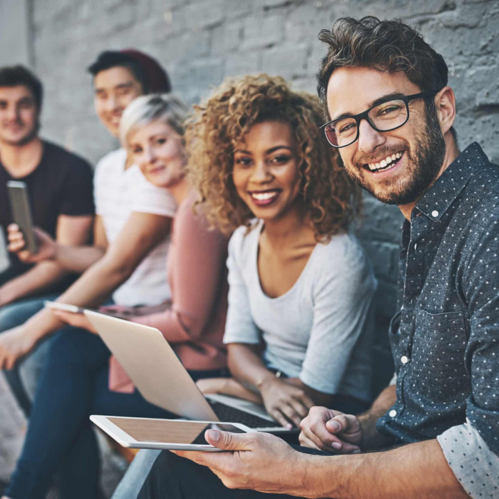 Shot of a diverse group of people social networking outside